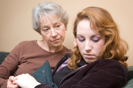 Mother with daughter shying away