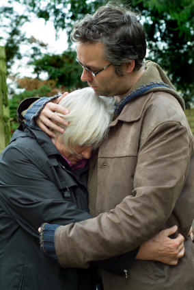 Man comforting woman